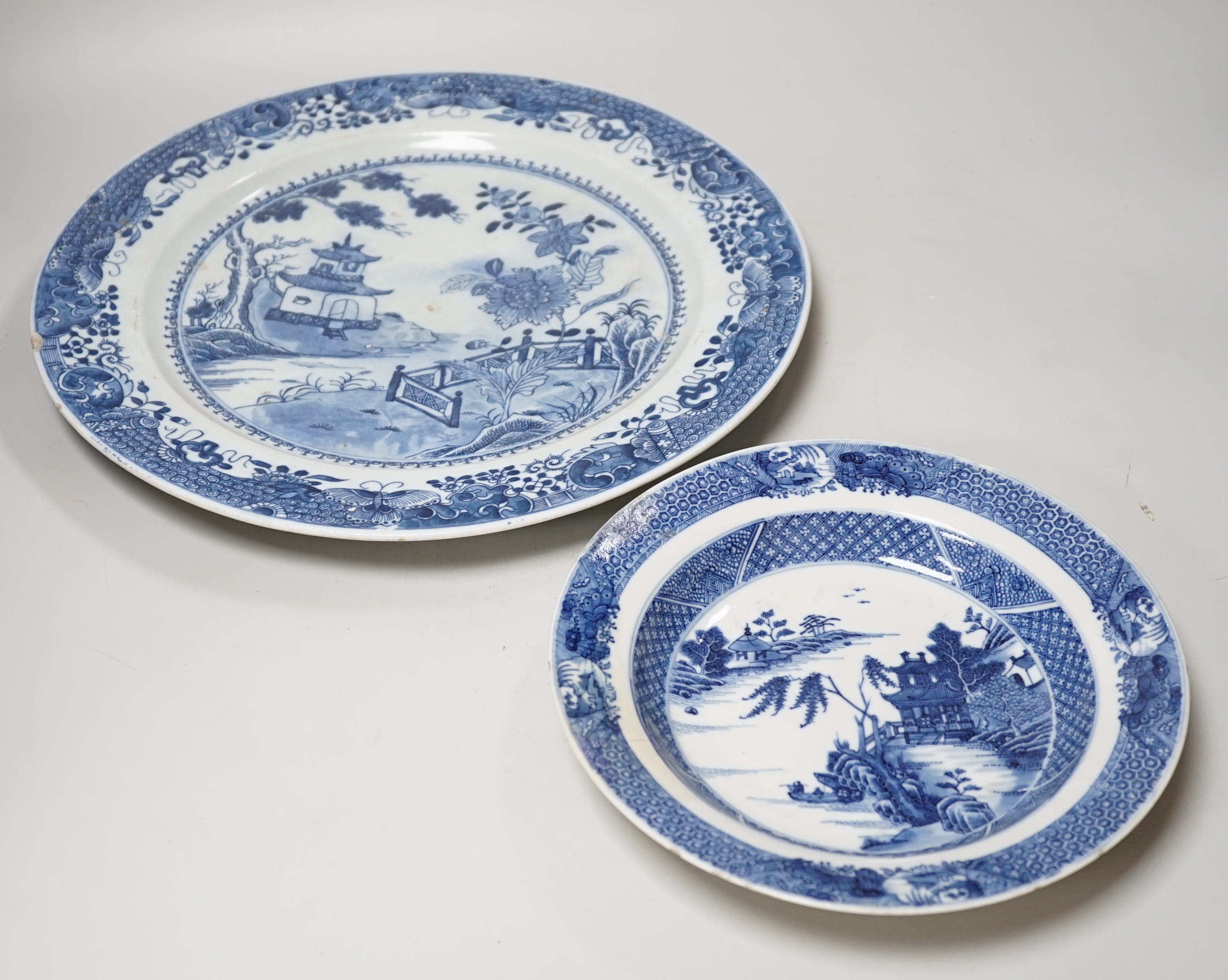 Two Chinese blue and white plates, 18th/19th century, largest 35cm